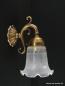 Preview: Kleine verspielte Jugendstil Wandlampe aus Messing goldbraun patiniert mit Blütenschim mit Ätzdekor 1xE27/40W nach unten