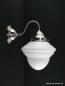Preview: Schlichte Art Deco Wandleuchte mit geschwungenem Arm, Material Messing - matt vernickelt, Zapfenschirm opal weiß, obere Wandungszone getreppt, 1xE27/40W, Spiegel-Badlampe