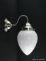 Preview: Schlichte Art Deco Wandleuchte mit geschwungenem Arm, Material Messing - matt vernickelt, opal weißer Zapfenschirm, 1xE27/40W, Spiegel-Badlampe