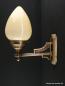 Preview: Wandlampe aus massivem Messingguss goldbraun patiniert mit elfenbeinfarbenen Schirm 1xE27/40W