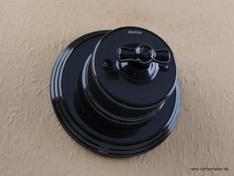 Preview: Garby Aus-Wechsel Porzellandrehschalter schwarz im Einfachrahmen Porzellan schwarz von vorn