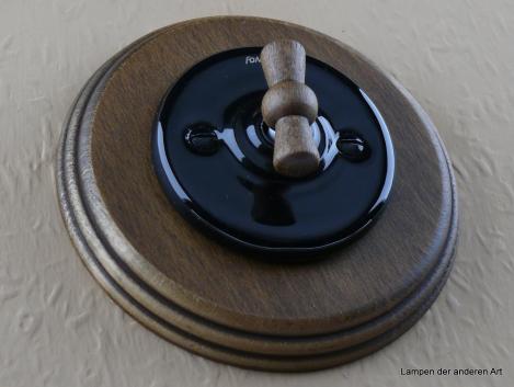 Preview: Garby Colonial Aus-Wechsel Porzellandrehschalter schwarz im Einfachrahmen Holz Buche gealtert Knebel Buche gealtert von vorn