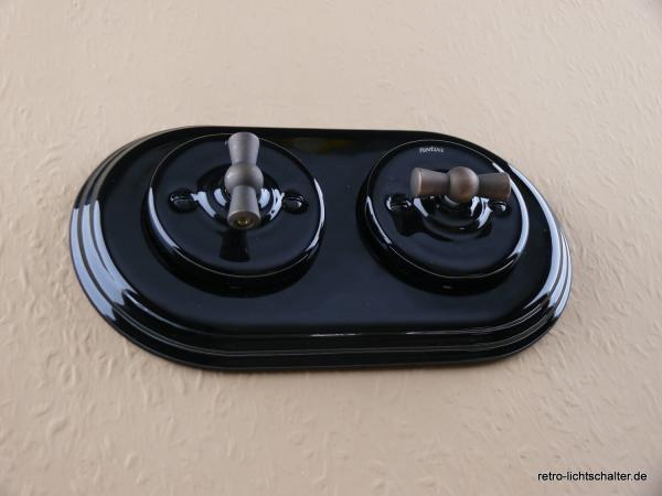 Garby Colonial 2fach Kombination, zwei Aus-Wechsel-Porzellandrehschalter schwarz,  Knebel Messing patiniert